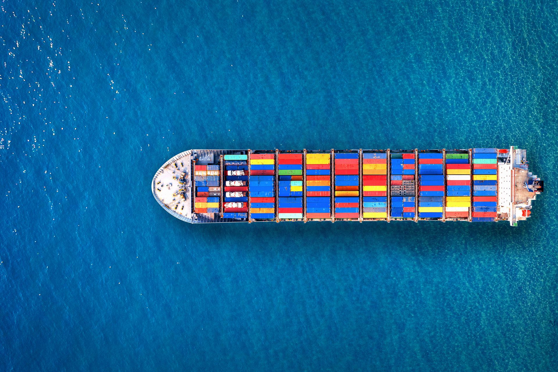 Aerial view of a fully loaded container cargo ship at sea